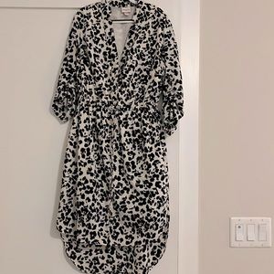 Dalmatian spotted shirt dress with drop length skirt in back. Cinched sleeves